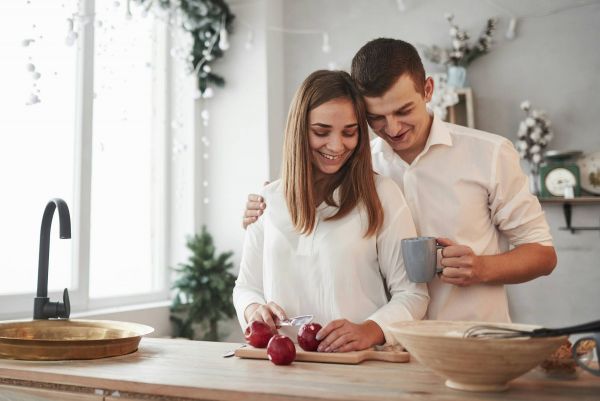 Couple drinking coffee in their apartment