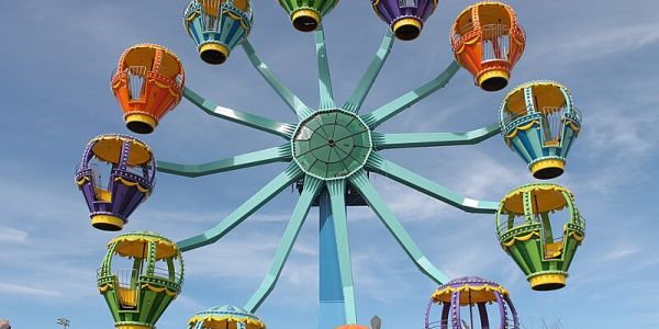 Colorful Ferris wheel with multicolored carriages at Morgans Wonderland Amusement Park in San Antonio, TX.