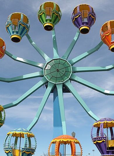 Colorful Ferris wheel with multicolored carriages at Morgans Wonderland Amusement Park in San Antonio, TX.