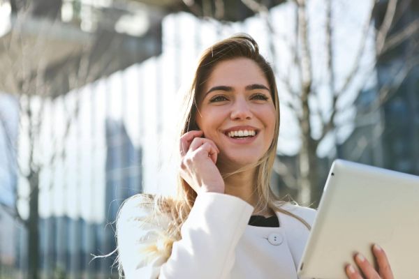 Happy woman smiling on phone call